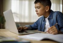 Boy using laptop