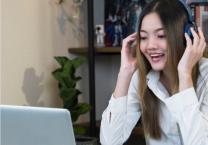 Girl using headset and laptop