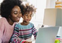 mum and child using laptop