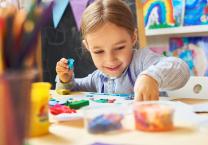 Early years boy playing with play-dough