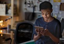 boy on tablet in his room